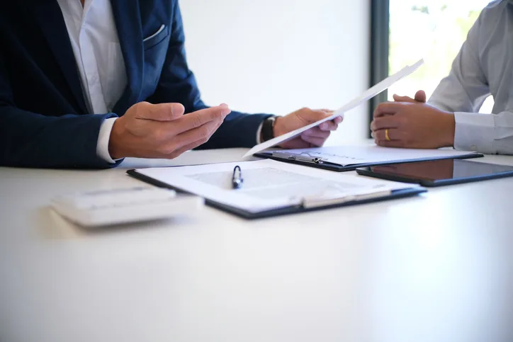 Sales manager giving advice application form document, considering mortgage loan offer for car and house insurance. Insurance, Business, Physical Injury, Contract, Document
